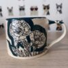 Teal "sketchy poppy" mug