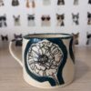 Teal "sketchy poppy" mug